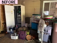 a garage with a lot of items and a fan